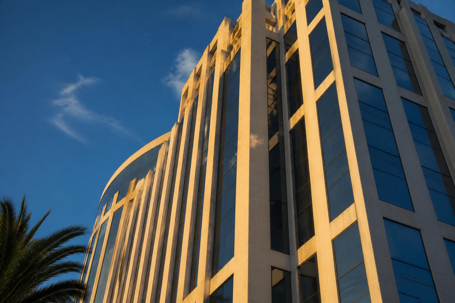 Office tower facade on the Wilshire corridor in Los Angeles at golden hour